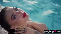 Play Emjay Rinaudo's Steamy Poolside Striptease and Shaved Pussy Exposure